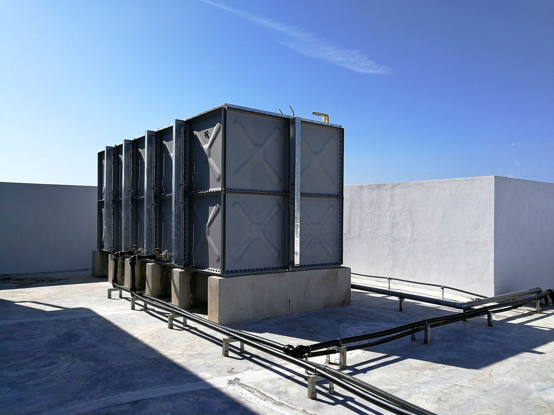 Water tank at roof top over the blue sky background